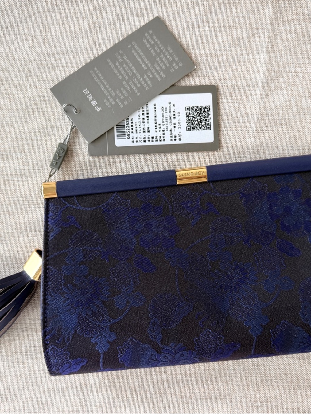Dark blue silk evening bag with a tassel